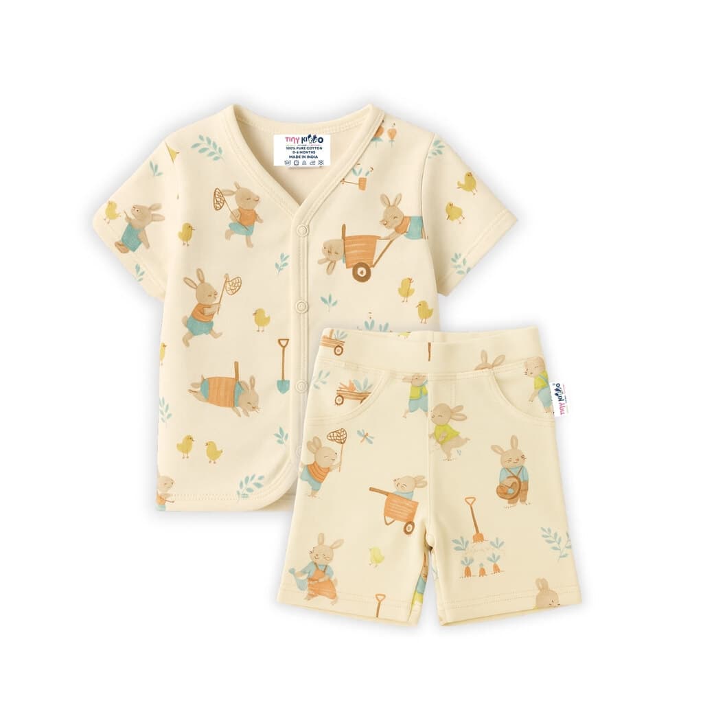 Snap-button shirt and shorts from the starter kit, cream cotton with a woodland animal print