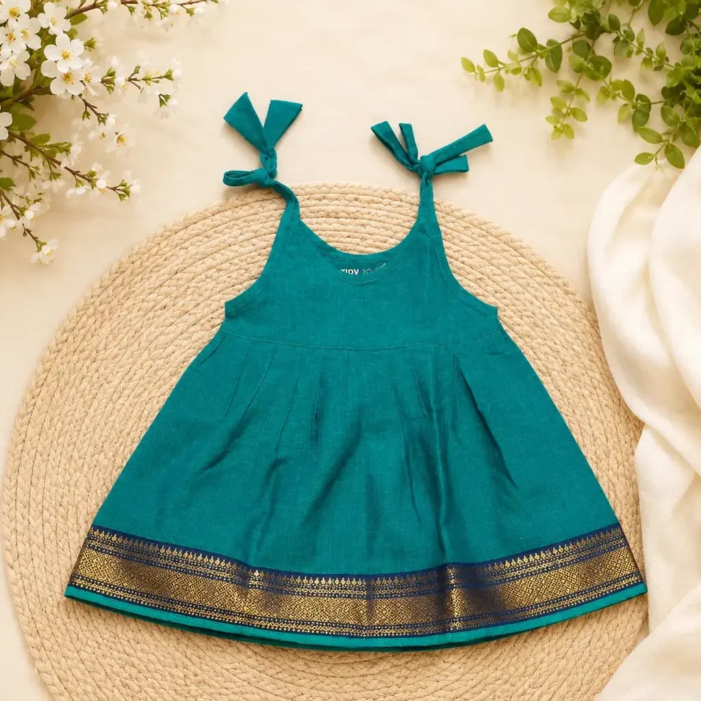 Teal Mangalagiri cotton knot frock with a gold zari border and tie shoulder straps