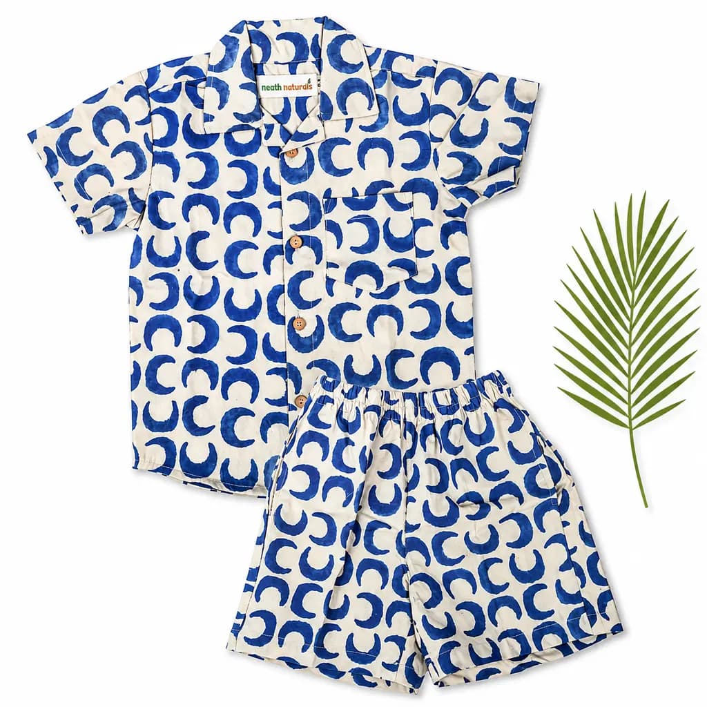 Baghru hand block printed shirt and shorts set in indigo on cream, laid flat